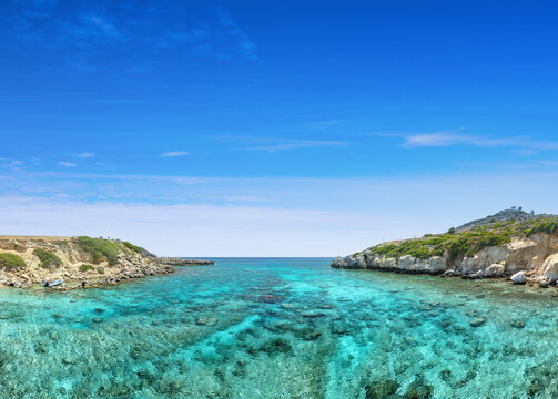 Crystal clear turquoise water in a Fokia closed bay. One of the famous places for great snorkeling. Vacation concept on Greece islands in Aegean and Mediterranean sea. Pefki. East Rhodes. Greece