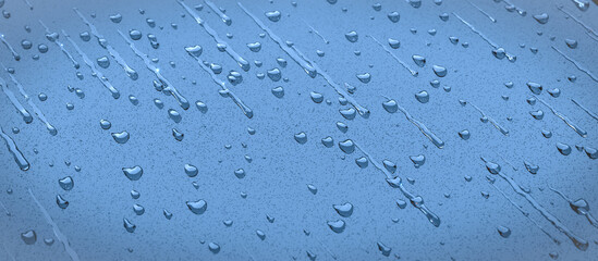 Rain or water drops on a window banner shaped. High resolution. Soft focus background.