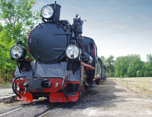 Fototapeta na wymiar Steam locomotive on the track
