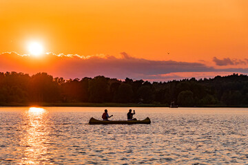 Stockholm, Sweden Canoists in a sunset view over Lake Malaren.