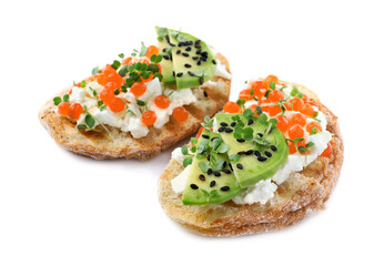 Delicious sandwiches with caviar, cheese, avocado and microgreens on white background