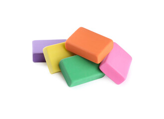 Pile of bright erasers on white background