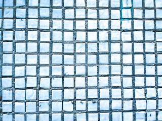 blue ceramic tile wall background texture. Rough and uneven