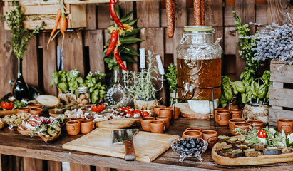 Obraz na płótnie Canvas Beautifully decorated snacks on the banquet table before the holiday. Catering food and drink on wedding party