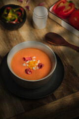 Salmorejo on plate, with wooden table