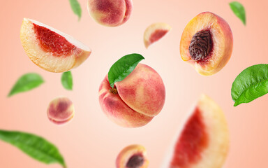 peach slices and leaves flying on peach colour background