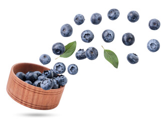 Blueberries fly out of a wooden plate on a white background, levitating blueberries. Isolated