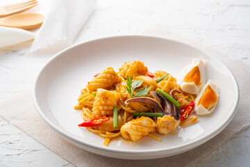 Stir Fried Pasta with squid and Salted Egg Yolk.Thai style fusion food