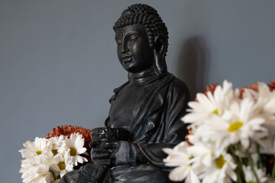 image of the Buddha adorned with flowers
