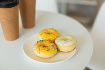 Sugar donuts on plate at home