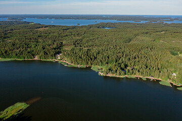 The coastline of the Gulf of Finland. There is a dense forest on the shore. Scandinavian nature, Finland. Photo from the drone.