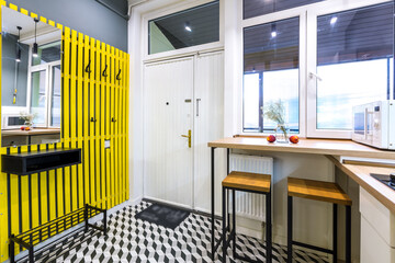Modern loft style kitchen with yellow interior doors