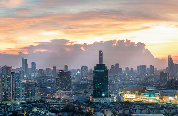 Fototapeta premium Bangkok, Thailand - Jun 02, 2021: Aerial view of Beautiful scenery view of Skyscraper Evening time Sunset creates relaxing feeling for the rest of the day. Selective focus.
