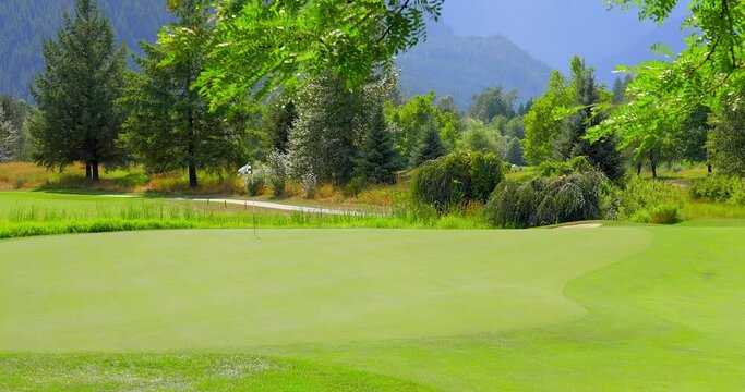 Establishing shot of golf course with gorgeous green and fantastic forest view in Vancouver, Canada, North America. Day time on July 2021. Still camera. ProRes 422 HQ.