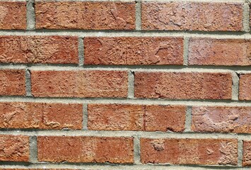 A close view of the red brick of the brick wall.