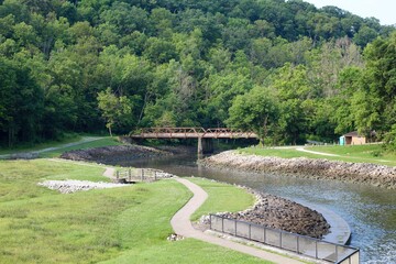 The steel bridge over the creek in the valley.