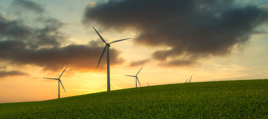 wind turbines at sunset