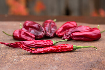 Dried peppers on a rusty table