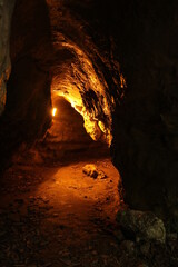 Cave with orange lights in Zugarramurdi