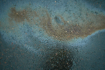 Oil slick on the asphalt road background