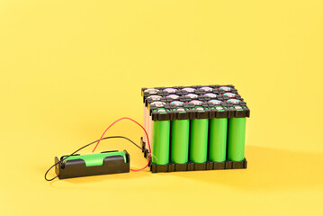 Lithium battery on yellow background.