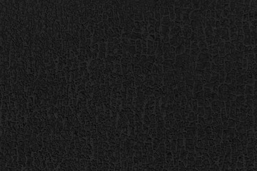 Black textured background from a rough surface