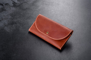 Beautiful leather brown purse made of leather to store paper money