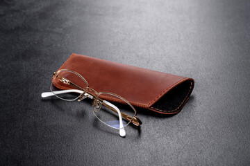Beautiful brown case made of leather designed to store glasses