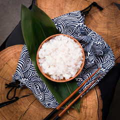 Shirataki rice or noodles on wooden table background. Konnyaku from konjac yam for wok. Healthy...