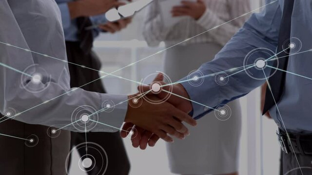Animation of network of connections over businessman handshake
