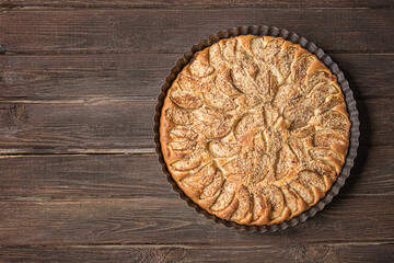 Homemade apple pie on a dark rustic background
