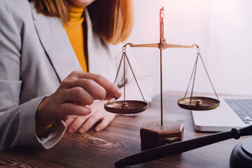 Business and lawyers discussing contract papers with brass scale on desk in office. Law, legal...