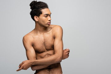 Fototapeta premium shirtless african american guy standing with crossed arms isolated on grey, beauty concept