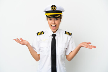 Airplane blonde woman pilot isolated on white background with shocked facial expression