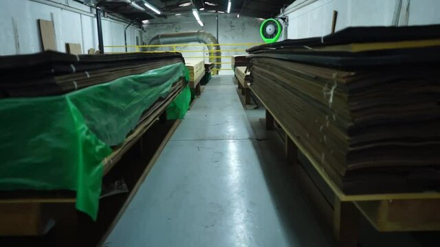 Warehouse with variety of wood for construction and repair. Wood Flooring Factory Production Line
