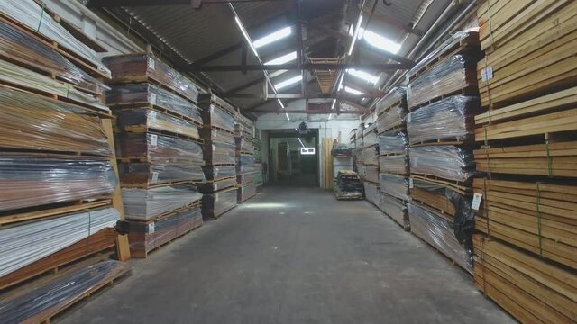 Warehouse with variety of wood for construction and repair. Wood Flooring Factory Production Line