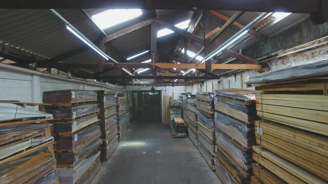 Warehouse with variety of wood for construction and repair. Wood Flooring Factory Production Line