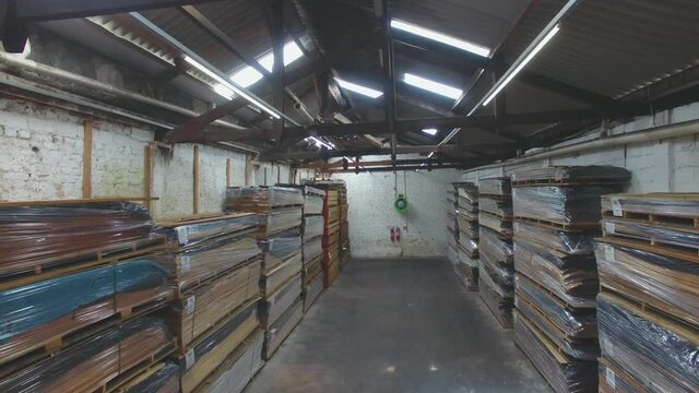 Warehouse with variety of wood for construction and repair. Wood Flooring Factory Production Line