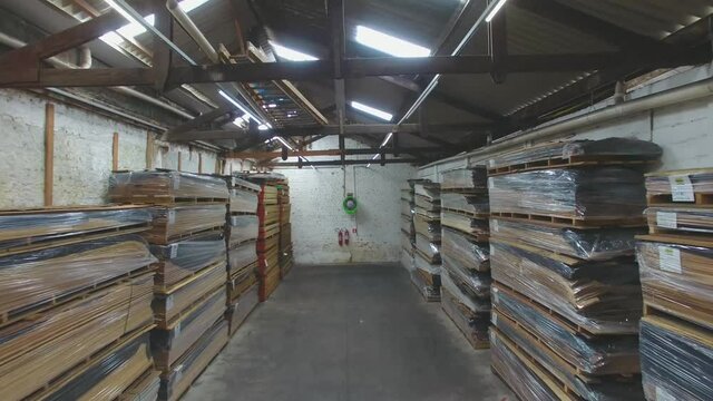 Warehouse with variety of wood for construction and repair. Wood Flooring Factory Production Line