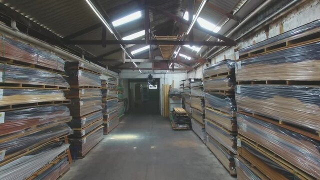 Warehouse with variety of wood for construction and repair. Wood Flooring Factory Production Line
