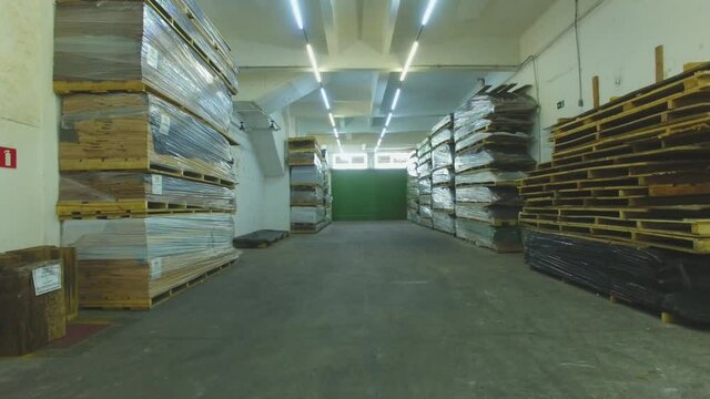 Warehouse with variety of wood for construction and repair. Wood Flooring Factory Production Line