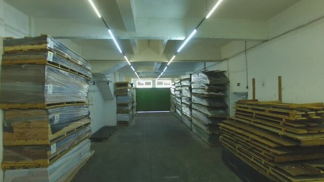 Warehouse with variety of wood for construction and repair. Wood Flooring Factory Production Line