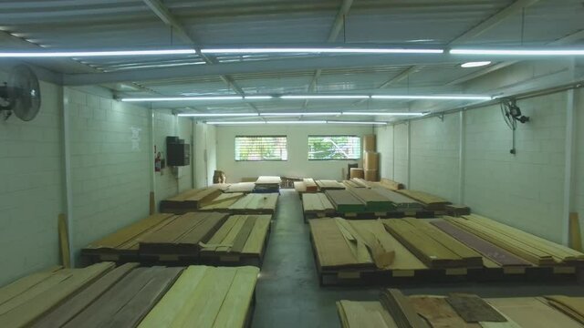Warehouse with variety of wood for construction and repair. Wood Flooring Factory Production Line