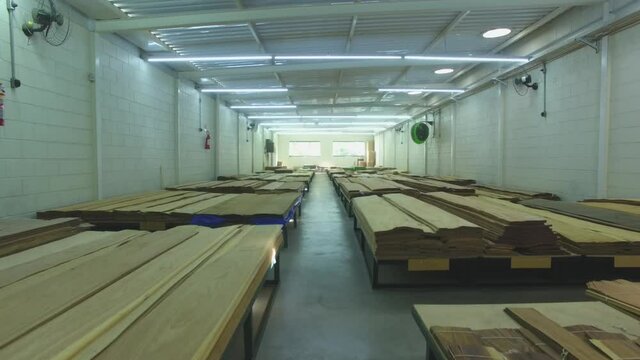 Warehouse with variety of wood for construction and repair. Wood Flooring Factory Production Line