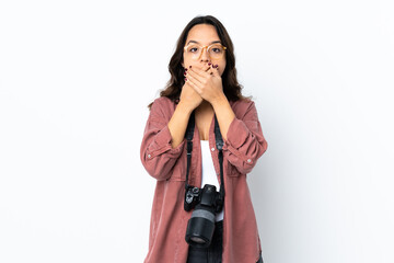 Young photographer woman over isolated white background covering mouth with hands