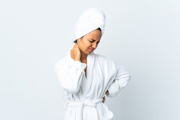 Young woman in bathrobe over isolated white background with neckache