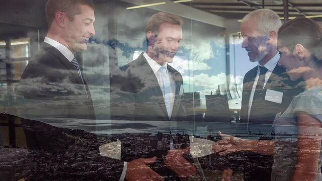 Animation of businessman handshake over cityscape
