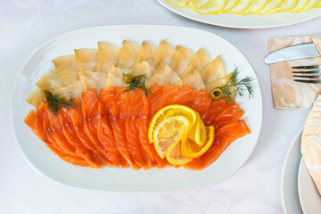 salt fish dish is on festive table top view close up. 