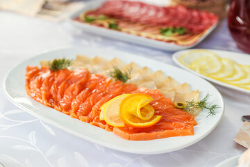 salt fish dish is on festive table close up. 