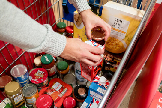 ROTHERHAM, UK – NOVEMBER 22, 2019: Food shopping and groceries are sorted in a trolley at Tesco supermarket